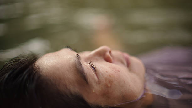 istock Woman floating in river. 2217702745