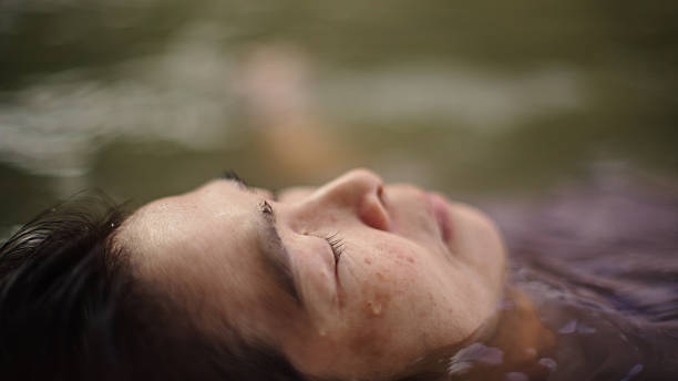 istock Woman floating in river. 2217702755