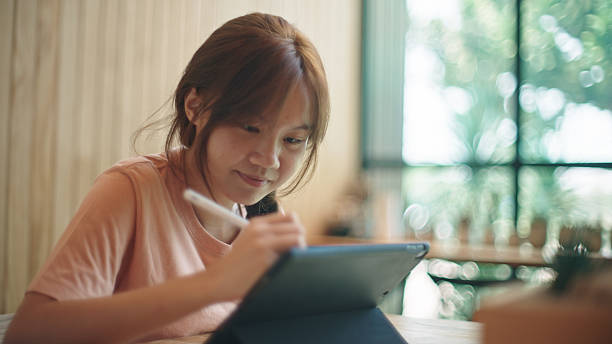 istock Teenage girl using digital tablet. 2217702949