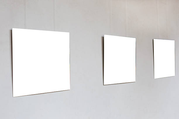 istock Blank large sheets of paper, canvas hanging on the wall as a mockup. Copy space. 2217704269