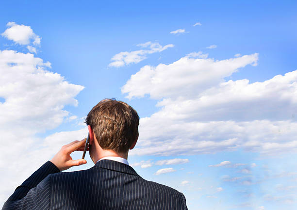 USA New York, young businesssman using smart phone