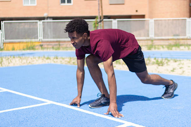 istock Young athlete preparing for a run on the track 2217706296