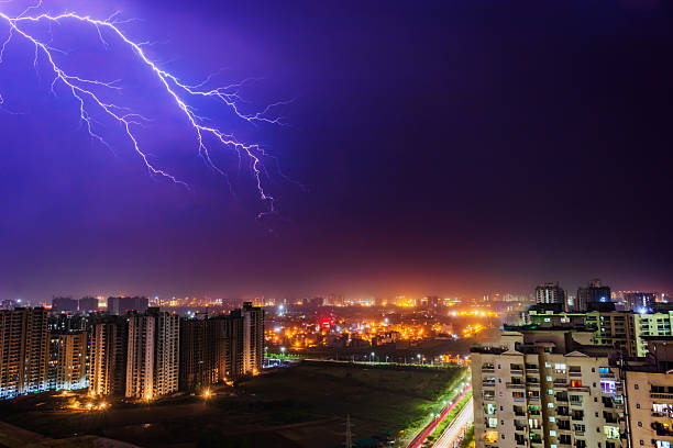 istock Dramatic Lightning Storm Over Illuminated City Skyline in Noida, India 2217708146
