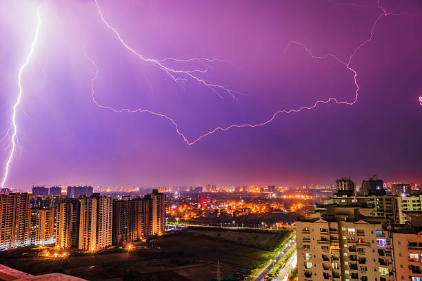 istock Dramatic Lightning Storm Over Illuminated City Skyline in Noida, India 2217708157