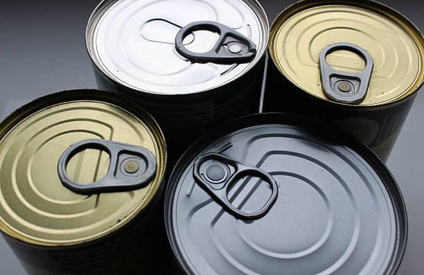 istock Canned preserves in variety containers close up view 2217710673