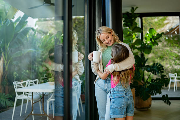 istock Mother and daughter talking embraced at home 2217711539