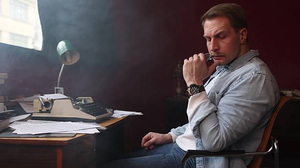 Thoughtful writer in smoky vintage study, cinematic composition