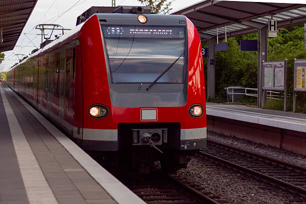 istock Electric train and empty platform. Railway station without anybody standing on the platform. 2217719776