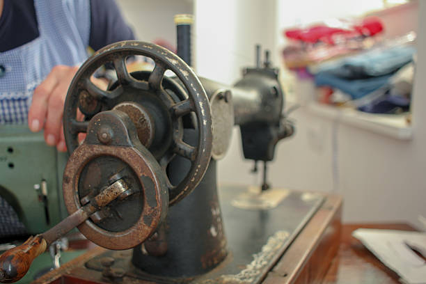 istock an elderly woman is working with an old sewing machine 2217722776