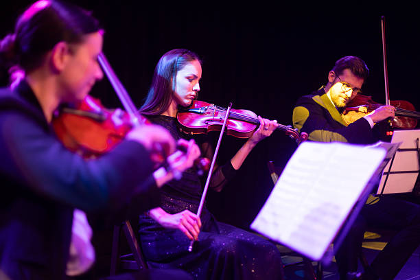 istock Three professional string players give a concert on stage 2217726458