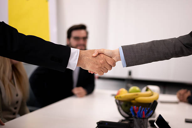 istock Business Agreement Handshake in a Professional Office Setting with Focus on Hands 2217726557