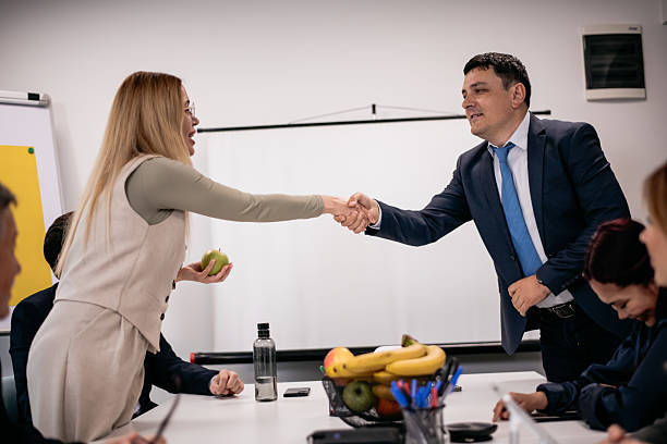 istock Professional handshake between colleagues during a meeting in a modern office setup 2217726606