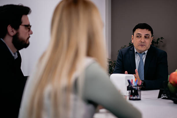 istock Professional meeting between business colleagues discussing plans in an office setting 2217726620