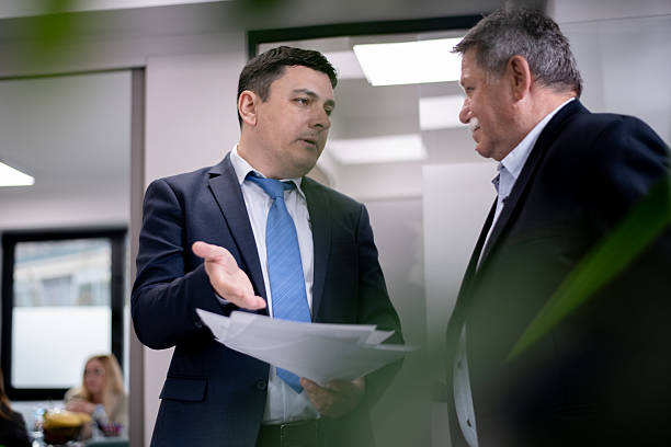 istock Business professionals engaged in a conversation in a modern office setting 2217726686