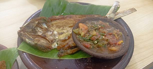 istock fried milkfish served with chilli sauce, 
