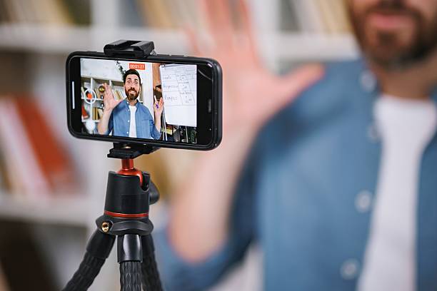 istock Focus on a phone screen recording a man tutor explaining rules of foreign language 2217731996