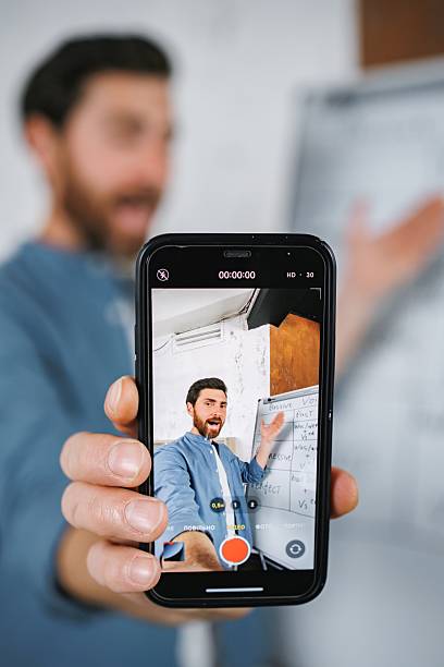 istock Focus on a phone screen recording a man tutor explaining rules of foreign language 2217732043
