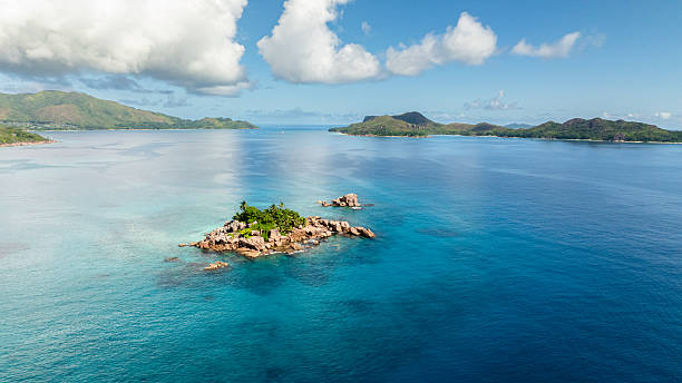 istock Tiny island amidst a vast blue ocean. Seychelles. 2217733547
