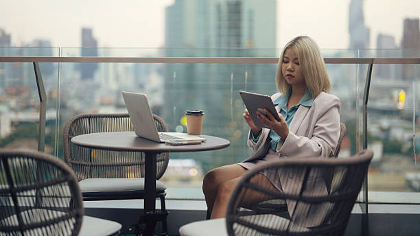 istock Asian lady working outside on a skyscraper 2217739460