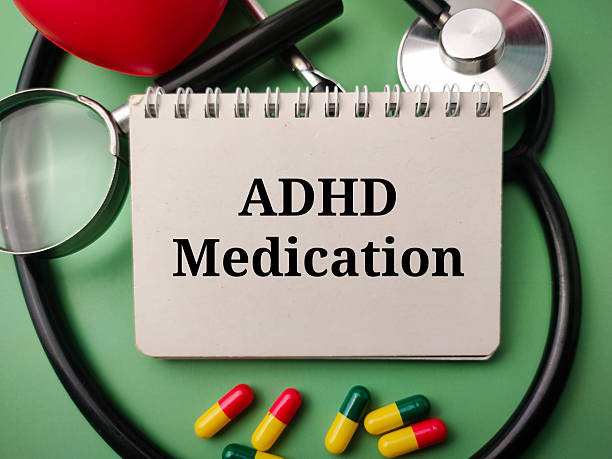istock Notebook and doctor's equipment with the word ADHD MEDICATION on a green background 2217740266