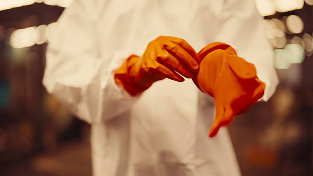 An ecologist taking samples of toxic waste in a dirty area