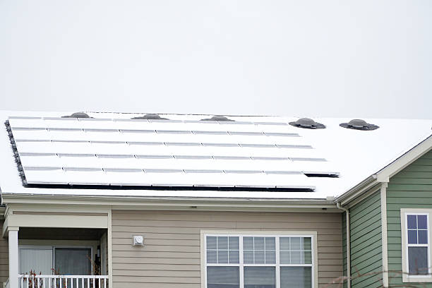 istock solar panel on the roof covered by snow after blizzard in winter 2217741481