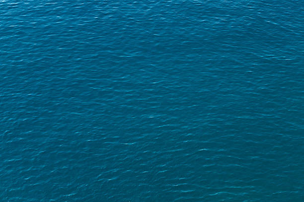 istock blue ocean with small waves as background, sea surface top view 2217745258