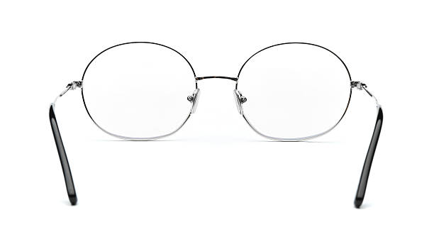 istock Glasses back view isolated on white background. Black eye glasses round frame with clear transparent lens for vision and read inside. Metal eyeglasses circle shape rear view vintage and retro style for design template and poster for sale or marketing 2217748349