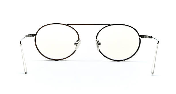istock Glasses back view isolated on white background. Black eye glasses round frame with clear transparent lens for vision and read inside. Metal eyeglasses circle shape rear view vintage and retro style for design template and poster for sale or marketing 2217748883