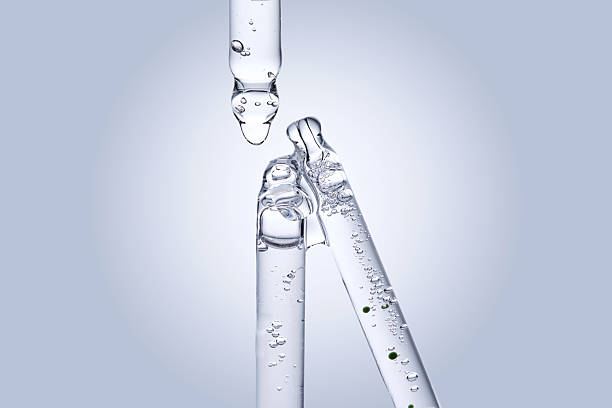istock Three different face serum pipettes on a neutral background. 2217749393
