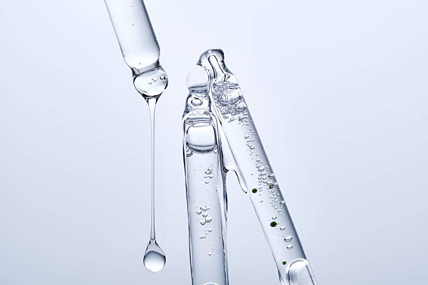 istock Three different face serum pipettes on a neutral background. 2217749424