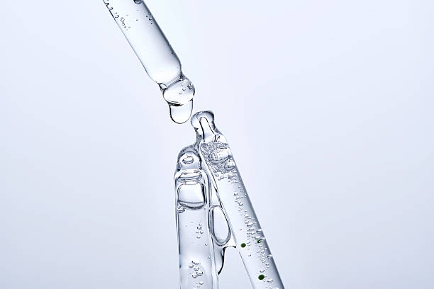 istock Three different face serum pipettes on a neutral background. 2217749467