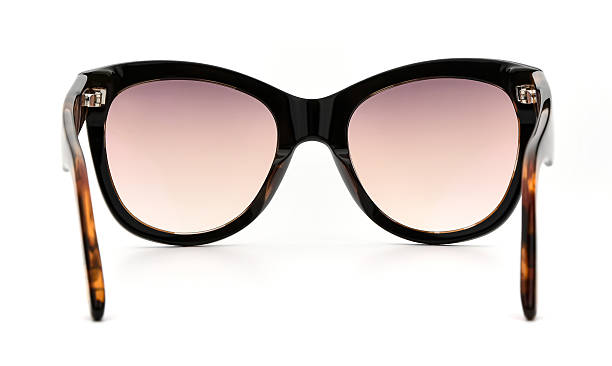 istock Sunglasses back view isolated on white background. Leopard color eyeglasses cat eye frame with yellow gold uv lens against sunlight on vacation. Glasses vintage shape rear view retro style for design template and poster for sale or marketing. Fashion 2217750277