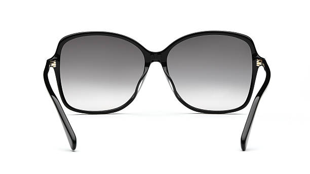 istock Sunglasses back view isolated on white background. Black eye glasses plastic square frame with uv lens against sunlight on vacation. Glasses square shape rear view vintage and retro style for design template and poster for sale or marketing. Fashion 2217750326