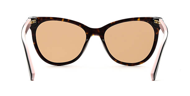 istock Sunglasses back view isolated on white background. Leopard color eyeglasses cat eye frame with yellow gold uv lens against sunlight on vacation. Glasses vintage shape rear view retro style for design template and poster for sale or marketing. Fashion 2217750584