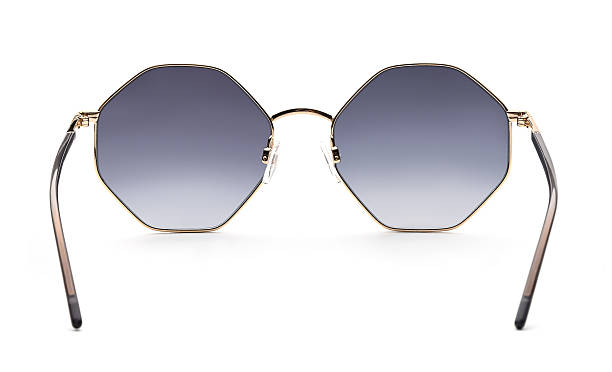 istock Sunglasses back view isolated on white background. Eyeglasses round frame with blue uv lens against sunlight on vacation. Glasses circle shape rear view vintage and retro style for design template and poster for sale or marketing. Fashion eyewear backside 2217750833