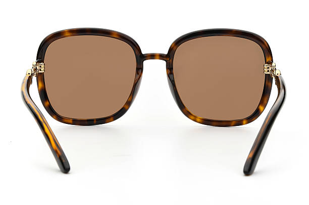 istock Sunglasses back view isolated on white background. Leopard color eyeglasses square frame with black uv lens against sunlight on vacation. Glasses vintage shape rear view retro style for design template and poster for sale or marketing. Fashion eyewear 2217750893