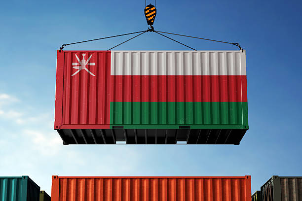 istock Oman trade cargo container hanging against clouds background 2217753614