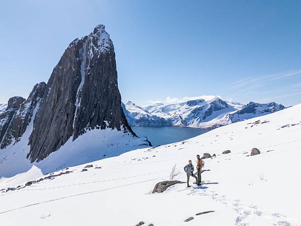 Hikers Exploring Snowy Mountain Landscape