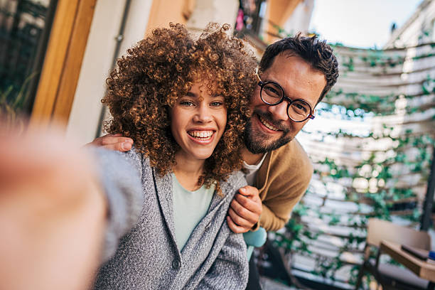 istock Happy couple taking a selfie outside a cafe 2217760368