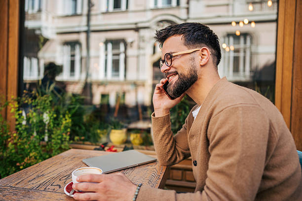 istock Freelancer enjoying a coffee break and making a phone call 2217761521