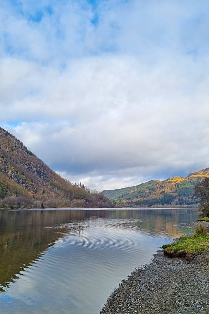 istock Tranquil Lakeside Autumn Landscape with Reflections and Cloudy Sky 2217762803
