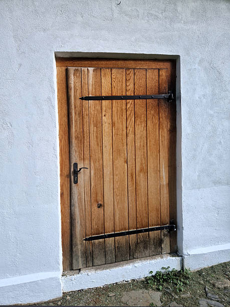 istock The old mill building has solid wooden shutters that protect the building from burglary. Thieves are less likely to break the windows and provide protection against vandalism. 2217764210