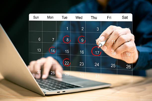 istock Businessman manages time for effective work. Calendar on the virtual screen interface. 2217768337