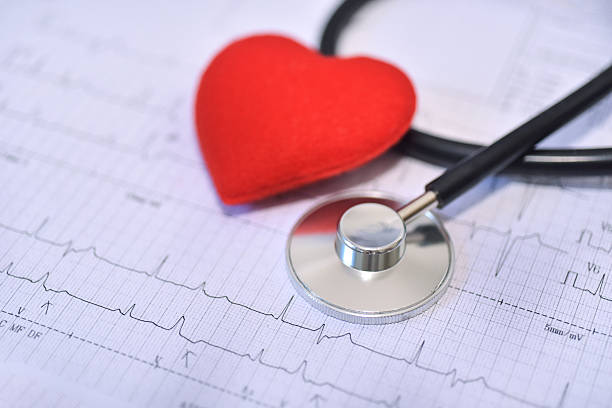 istock Stethoscope with red heart on EKG graph report background. 2217771289