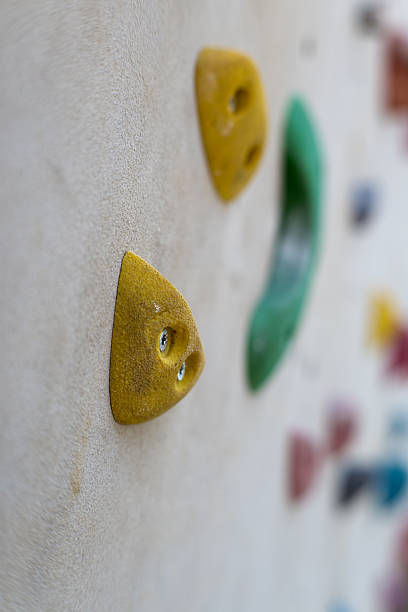 istock Climbing wall, colorful fixtures attached to the wall. 2217772029
