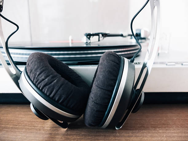 Headphones and vinyl turntable close-up.