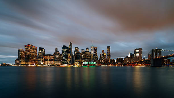 istock Manhattan skyline at night seen from Brooklyn 2217778245