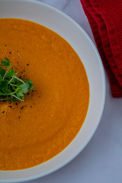 istock Homemade Carrot Soup in a Rustic Bowl 2217778417