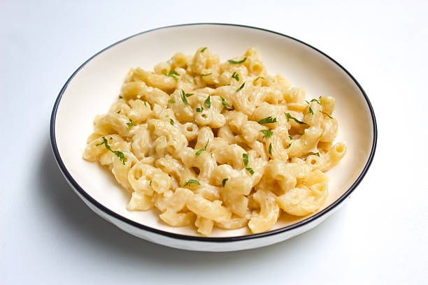 istock a plate of macaroni and cheese pasta isolated on white background 2217781532